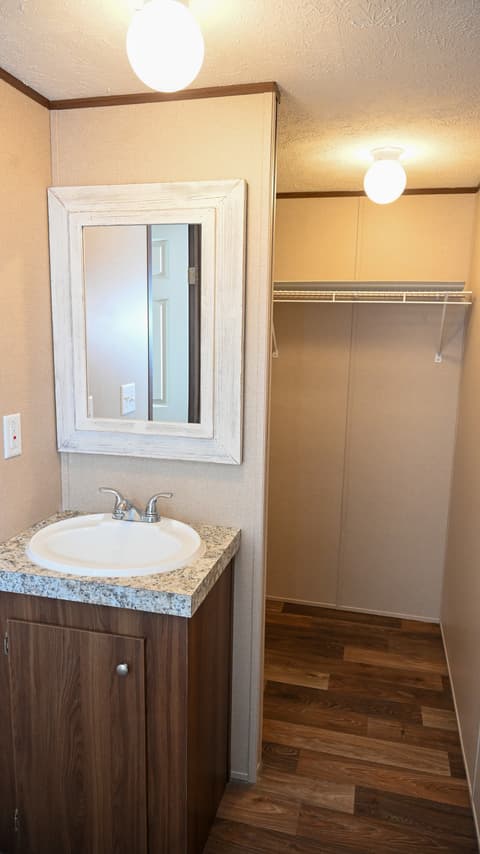 Primary bathroom at 31 blue water Drive, Cicero, IN — Updated primary bath with granite and hardwood floors.
