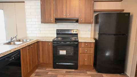 Kitchen at 31 blue water Drive, Cicero, IN — Updated kitchen with granite counters and modern appliances.