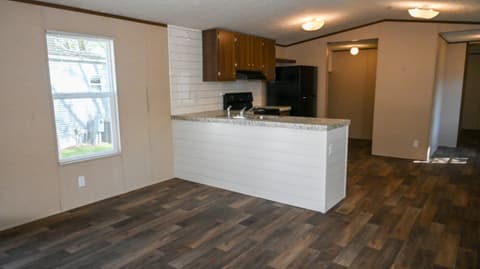 Kitchen at 31 blue water Drive, Cicero, IN — Updated kitchen with granite counters and modern appliances.