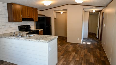 Kitchen at 31 blue water Drive, Cicero, IN — Updated kitchen with granite island and modern fixtures.