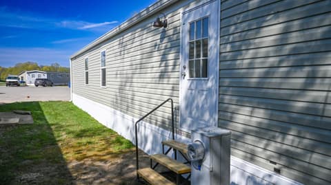 Front exterior at 31 blue water Drive, Cicero, IN — Clean mobile home with modern siding and accessible entry.
