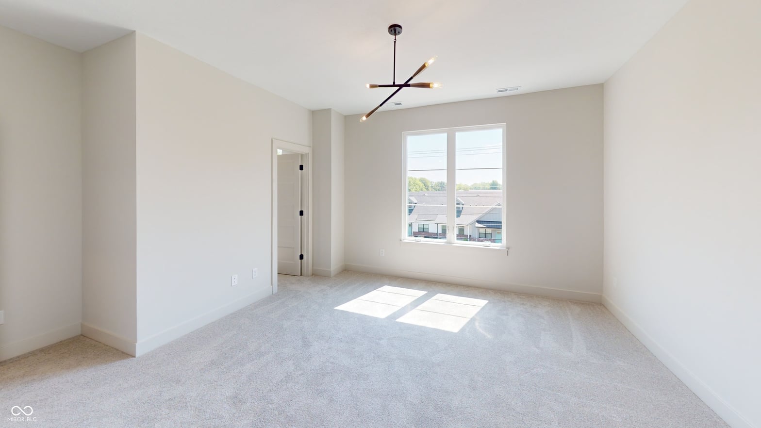 Bright, spacious primary suite with abundant natural light and modern fixtures.