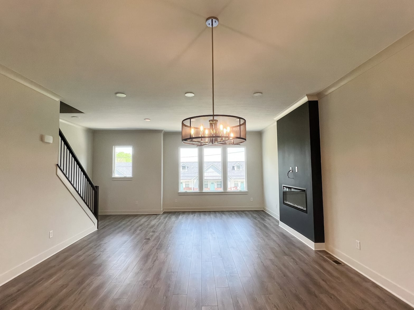 Bright, open great room with premium hardwood and modern finishes.