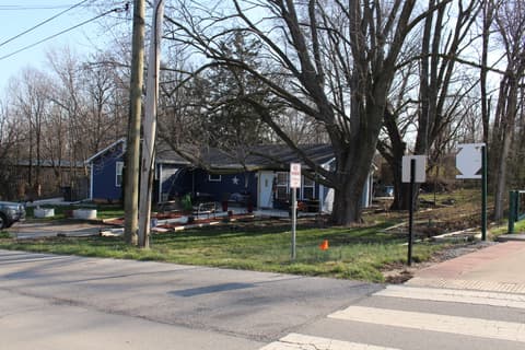 Front exterior at 306 S Cherry Street, Westfield, IN — Charming cottage with mature trees and open yard.