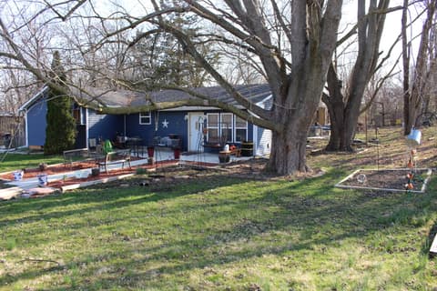 Backyard at 306 S Cherry Street, Westfield, IN — Charming cottage with mature trees and established gardens.