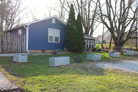 Front exterior at 306 S Cherry Street, Westfield, IN — Spacious lot with mature trees and garden potential.
