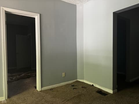 Bedroom at 642 N Oxford Street, Indianapolis, IN — Spacious bedroom with multiple closet storage options.