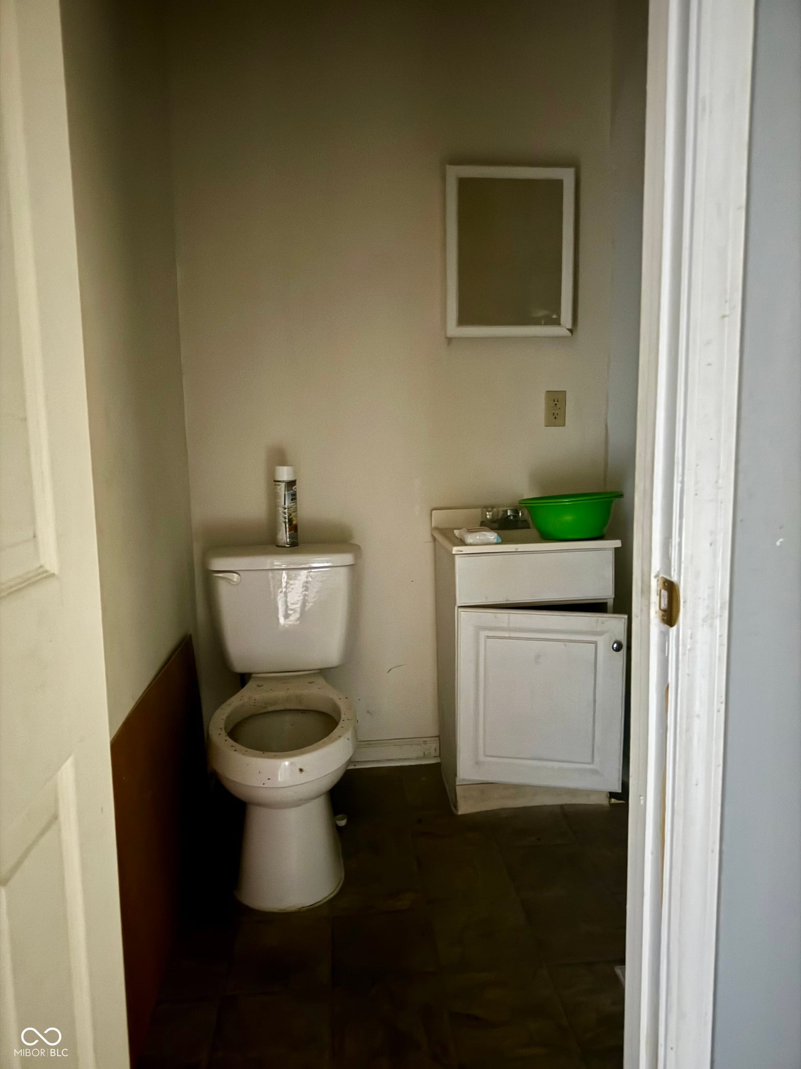 Bathroom at 642 N Oxford Street, Indianapolis, IN — Compact bathroom with dark flooring and basic fixtures.