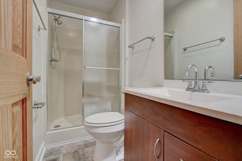 Primary bathroom at 303 Wellington Overlook, Noblesville, IN — Modern primary bath with double vanity and glass shower.