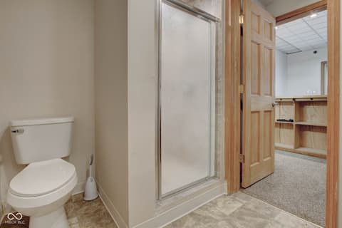 Primary bathroom at 303 Wellington Overlook, Noblesville, IN — Primary bath with walk-in shower and attached closet.