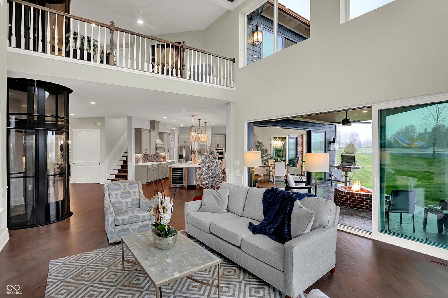 Luxurious two-story living with soaring ceilings and natural light.