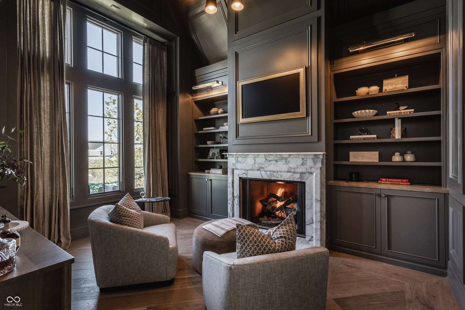 Sophisticated family room with working fireplace and built-ins.