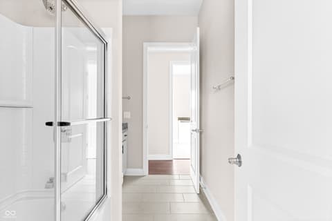 Primary bathroom at 4248 Stone Lake Drive, Zionsville, IN — Bright, modern bathroom with spacious walk-in shower.