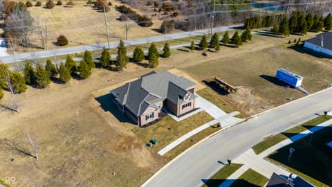 Aerial view at 4248 Stone Lake Drive, Zionsville, IN — Spacious lot with mature trees in established community