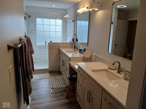 Primary bathroom at 5983 Clearview Drive, Carmel, IN — Spa-like primary bath with dual vanities and luxe finishes.