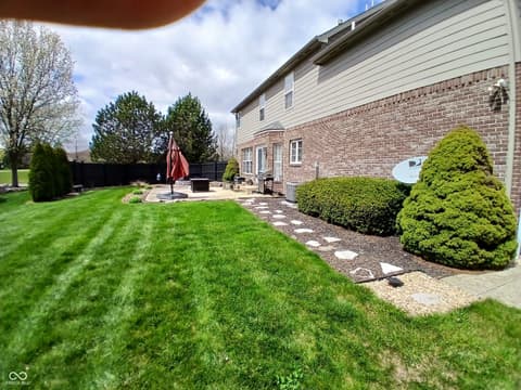 Backyard at 5983 Clearview Drive, Carmel, IN — Spacious backyard with professional landscaping and patio.