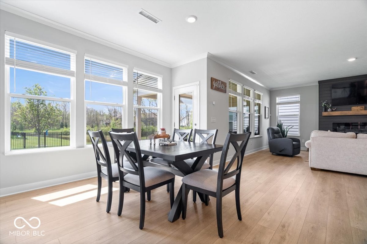 Bright dining area with abundant natural light and modern finishes.