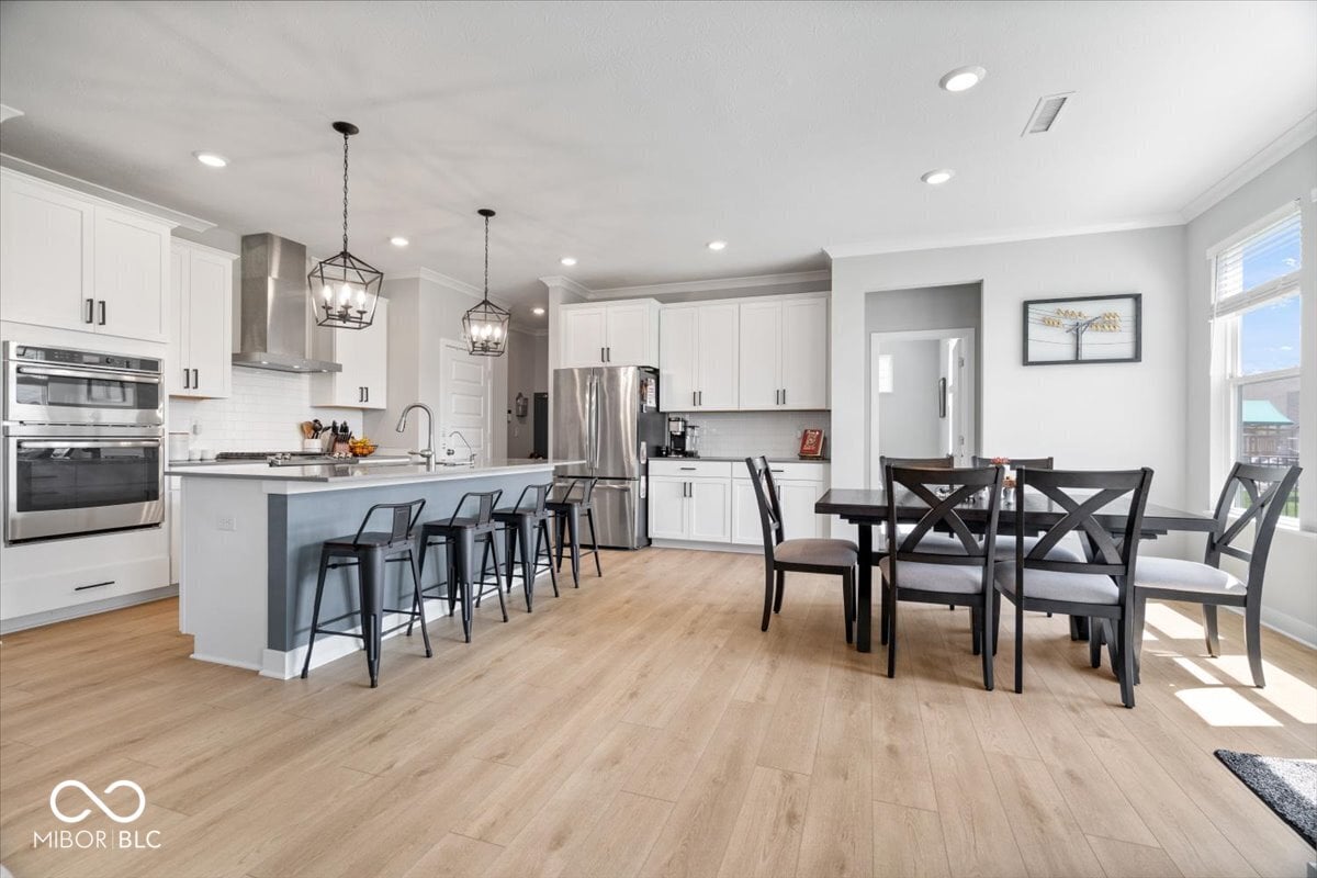 Stunning open-concept kitchen with island and dining area.