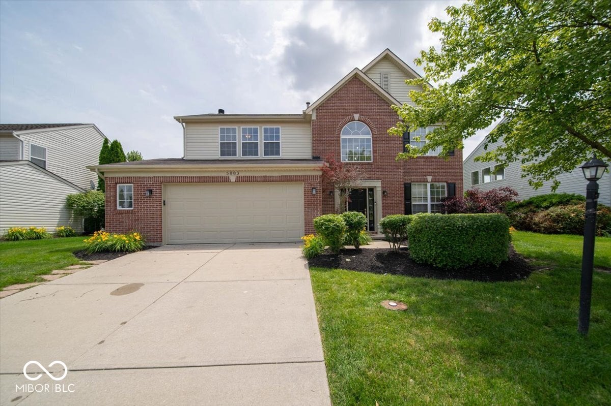Front exterior at 5883 Sandalwood Drive, Carmel, IN