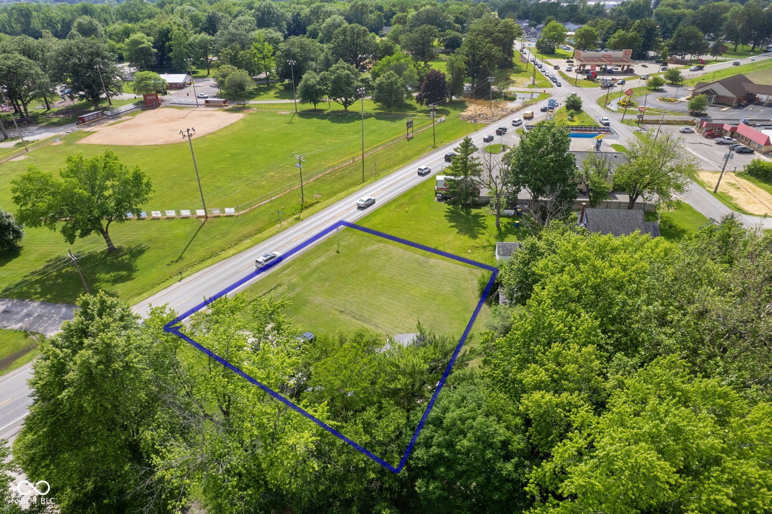 Aerial view at 2710 W State Road 38, Sheridan, IN — Prime commercial lot with road frontage and park access.