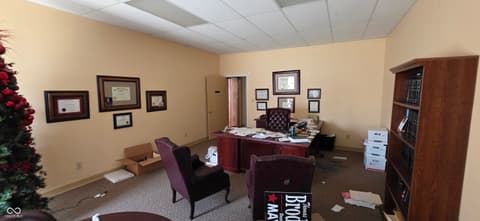 Home office at 22 W 8th Street, Anderson, IN — Professional office space with built-in wood cabinetry.