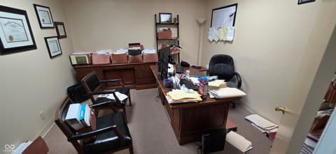 Home office at 22 W 8th Street, Anderson, IN — Spacious traditional office with built-in wood cabinetry.