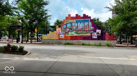 Front exterior at 925 Veterans Way, Carmel, IN — Vibrant midtown plaza location with urban walkability.