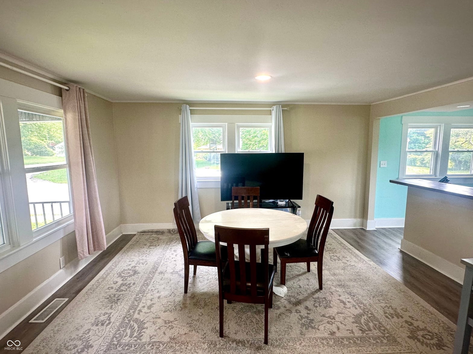 Family room at 514 E 2nd Street, Sheridan, IN — Bright family room with multiple windows and open layout.