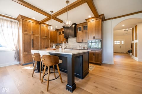 Kitchen at 14565 Bedford Falls Drive, Carmel, IN — Modern kitchen with exposed beams and premium finishes.