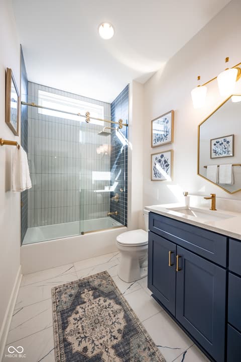 Primary bathroom at 14565 Bedford Falls Drive, Carmel, IN — Modern luxury bathroom with updated fixtures and finishes.