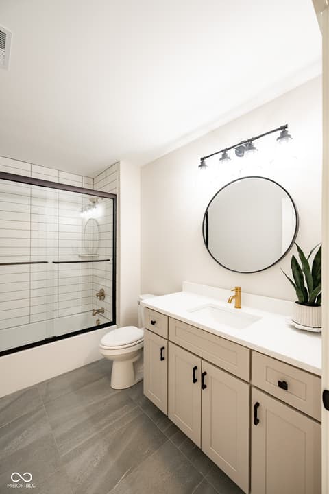 Primary bathroom at 14565 Bedford Falls Drive, Carmel, IN — Stunning renovated primary bath with modern finishes.