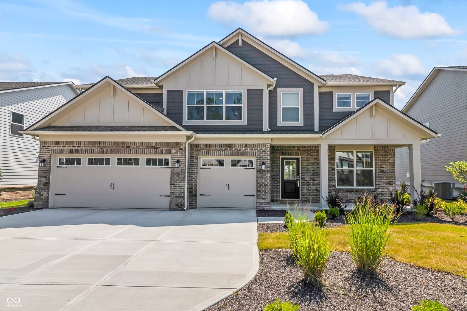 Front exterior at 1438 Chatham Hills Boulevard, Westfield, IN — Modern two-story home with updated brick and mixed siding.