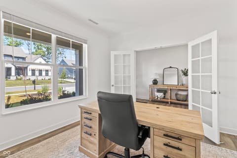 Home office at 1438 Chatham Hills Boulevard, Westfield, IN — Bright office with expansive windows and modern finishes.