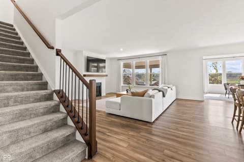Living room at 1438 Chatham Hills Boulevard, Westfield, IN — Bright open living space with panoramic views.