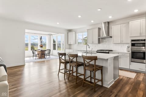 Kitchen at 1438 Chatham Hills Boulevard, Westfield, IN — Bright modern kitchen with island and scenic views.