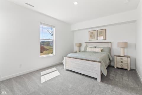 Primary bedroom at 1438 Chatham Hills Boulevard, Westfield, IN — Bright primary bedroom with scenic countryside views.