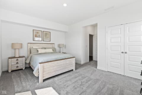 Primary bedroom at 1438 Chatham Hills Boulevard, Westfield, IN — Spacious primary suite with ensuite bath and dual closets.