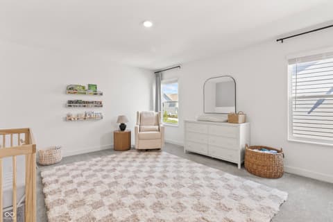 Primary bedroom at 1438 Chatham Hills Boulevard, Westfield, IN — Bright modern primary suite with spa-like ensuite.