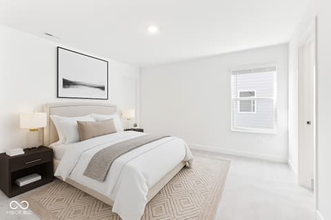 Primary bedroom at 1438 Chatham Hills Boulevard, Westfield, IN — Bright, modern primary suite with elegant neutral finishes.