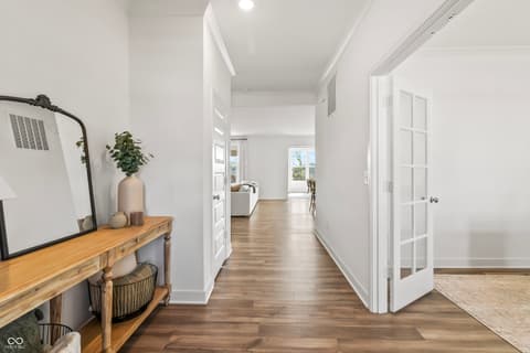 Hallway at 1438 Chatham Hills Boulevard, Westfield, IN — Bright hallway with hardwood floors and modern finishes.