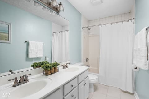 Primary bathroom at 2025 W Morse Drive, Cicero, IN — Bright primary bath with dual vanity and updated fixtures.