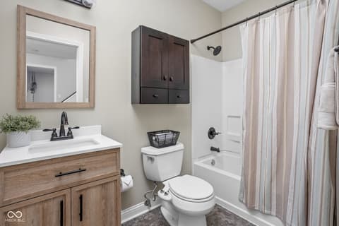 Primary bathroom at 2025 W Morse Drive, Cicero, IN — Updated primary bath with modern fixtures and wood vanity.