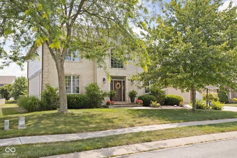Front exterior at 2025 W Morse Drive, Cicero, IN — Charming brick home with mature trees and curb appeal.