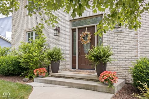 Front exterior at 2025 W Morse Drive, Cicero, IN — Attractive brick exterior with elegant double-door entry.