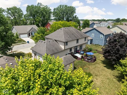 Aerial view at 2025 W Morse Drive, Cicero, IN — Charming two-story with expansive deck and mature yard.