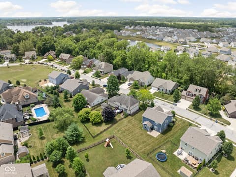 Aerial view at 2025 W Morse Drive, Cicero, IN — Waterfront community with scenic lake and tree-lined lots.