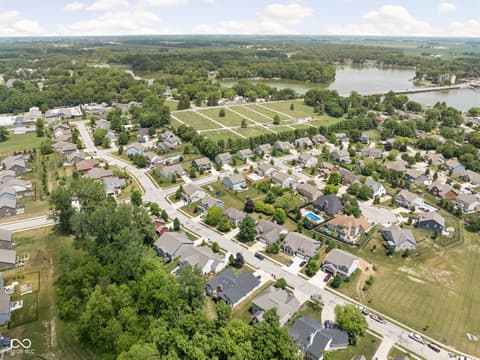 Aerial view at 2025 W Morse Drive, Cicero, IN — Scenic river community with mature trees and vineyards.
