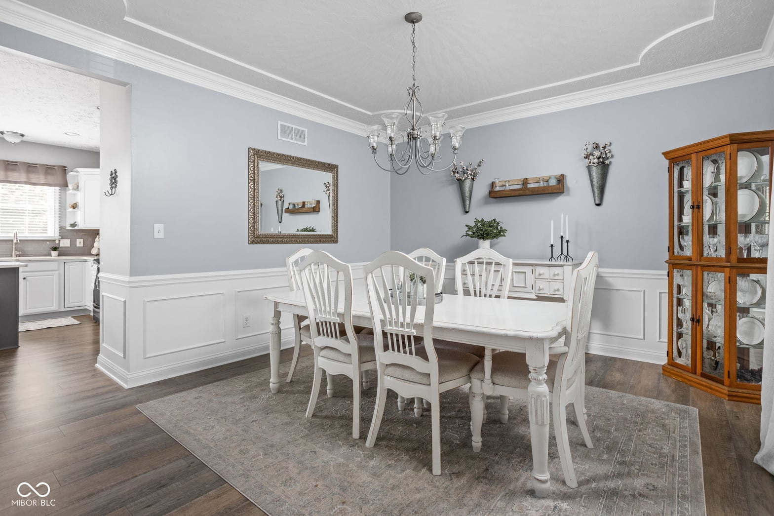Dining room at 2025 W Morse Drive, Cicero, IN — Elegant dining with wainscoting and tray ceiling details.