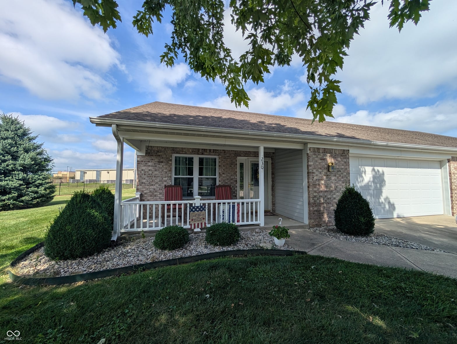 Front exterior at 230 Blue Ribbon Court, Rushville, IN