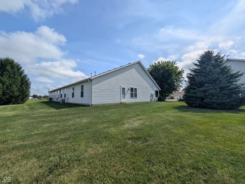 Side exterior at 230 Blue Ribbon Court, Rushville, IN